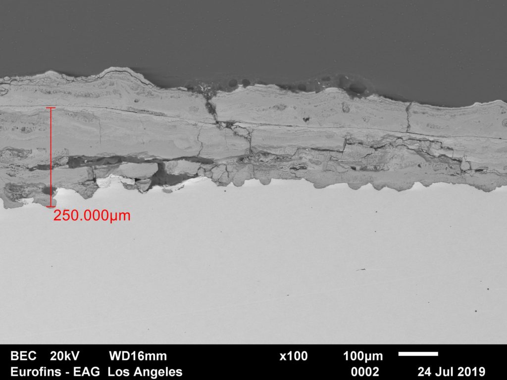 Scanning Electron Microscope photo showing CRS penetration of tightly adhered intact rust in microns