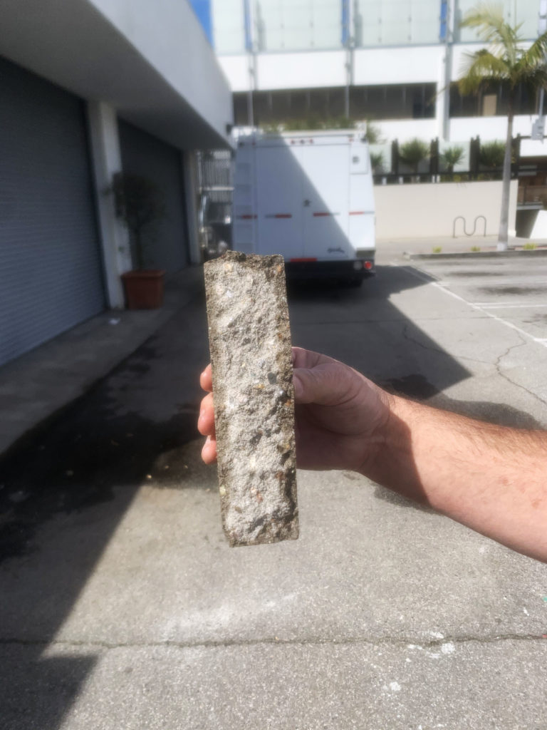 Concrete blocks taken out, cracked open to reveal a completely dry interior cross section